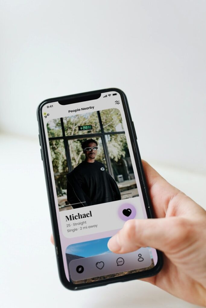 a person holding a cell phone with a picture of a man on it
