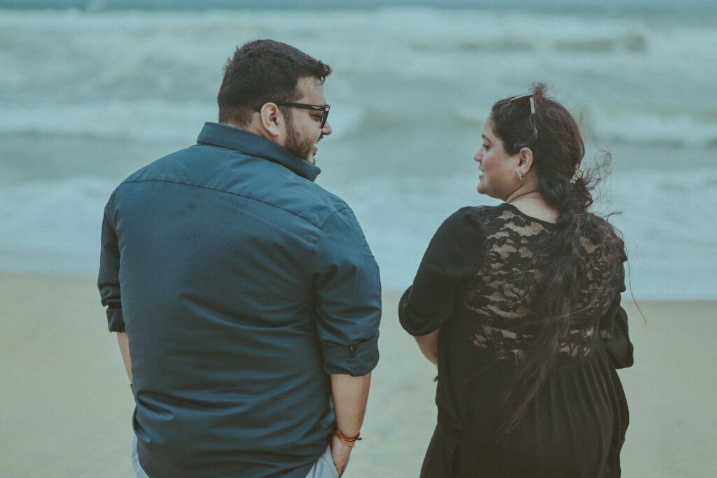 Couple looking at each other on a beach