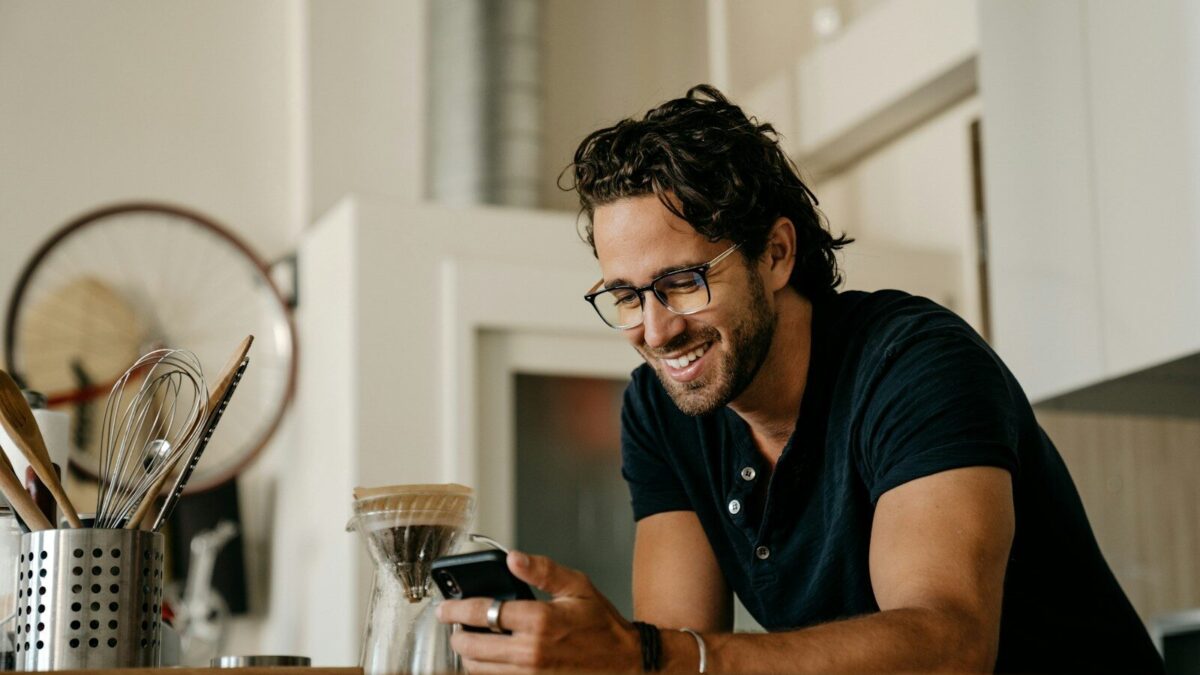 man in black crew neck t-shirt wearing black framed eyeglasses