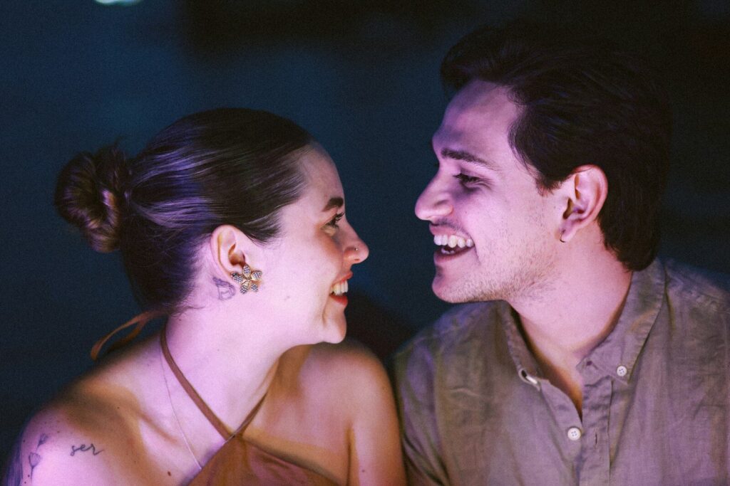 A couple laughing together at night