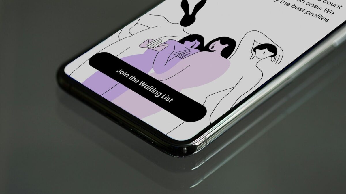 a cell phone with a picture of two people on it