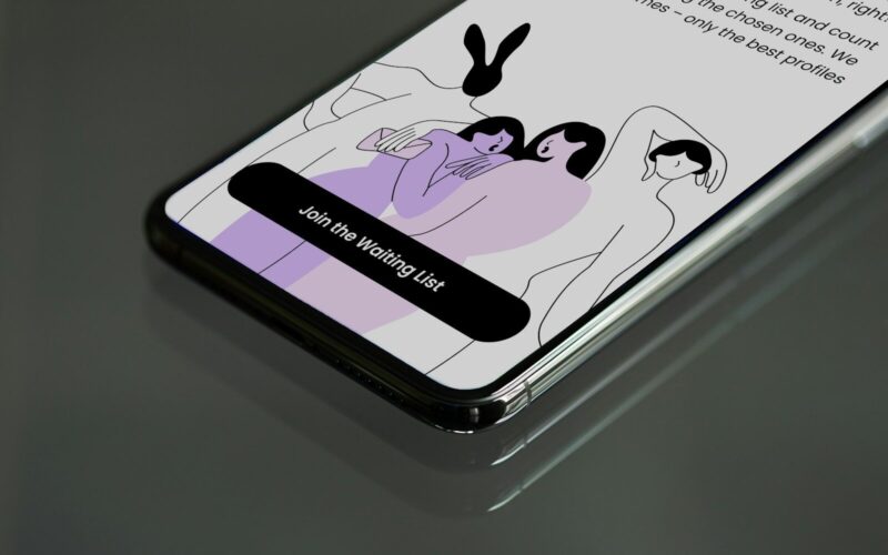 a cell phone with a picture of two people on it