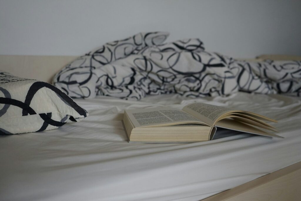 book on white and black textile