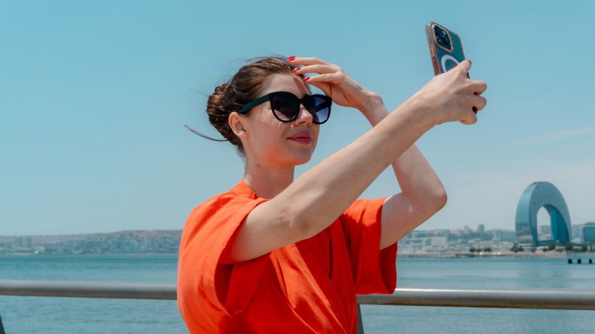 Woman taking a selfie with a smartphone