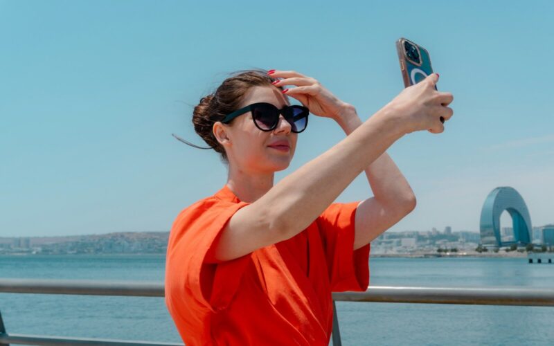 Woman taking a selfie with a smartphone