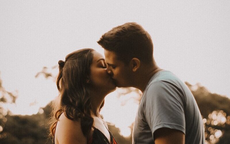 couple kissing during daytime