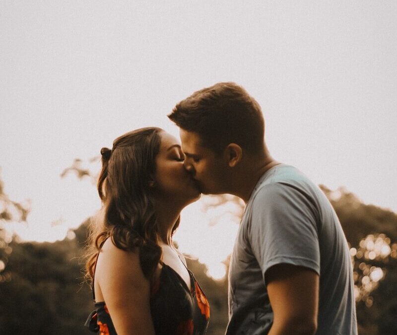 couple kissing during daytime