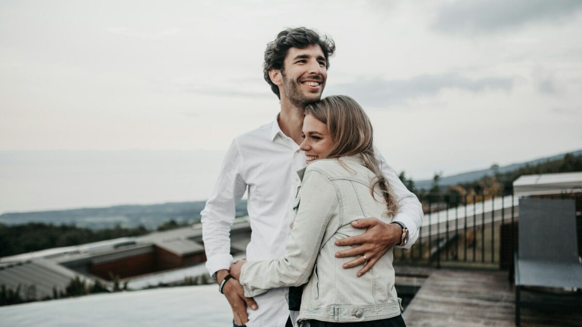 man and woman hugging each other